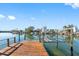 Wooden dock with lift for boat access; calm waters at 3738 Belle Vista E Dr, St Pete Beach, FL 33706