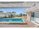 Relaxing rectangular pool with patio and water view at 3738 Belle Vista E Dr, St Pete Beach, FL 33706