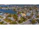 Aerial view of the home, showcasing its location in a neighborhood near the water at 410 140Th E Ave, Madeira Beach, FL 33708