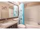 Bathroom with shower/tub, granite vanity, and mirrored medicine cabinet at 4202 Las Vegas Dr, New Port Richey, FL 34653