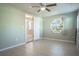 Bedroom with unique window and access to hallway at 4202 Las Vegas Dr, New Port Richey, FL 34653