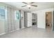 Bedroom with tile floors, ceiling fan, and double closets at 4202 Las Vegas Dr, New Port Richey, FL 34653