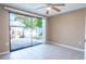 Bedroom with sliding glass doors to patio at 4202 Las Vegas Dr, New Port Richey, FL 34653