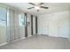 Bedroom with tile floors, ceiling fan, and double closets at 4202 Las Vegas Dr, New Port Richey, FL 34653