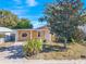 Front view of house with driveway and landscaping at 4202 Las Vegas Dr, New Port Richey, FL 34653
