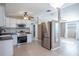 Modern kitchen with white cabinets and stainless steel appliances at 4202 Las Vegas Dr, New Port Richey, FL 34653