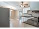 Eat-in kitchen with white cabinets, stainless steel appliances, and tile floors at 4202 Las Vegas Dr, New Port Richey, FL 34653
