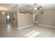 Open living space with tile floors and partial kitchen view at 4202 Las Vegas Dr, New Port Richey, FL 34653
