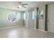 Living room with tile floors, window, and ceiling fan at 4202 Las Vegas Dr, New Port Richey, FL 34653