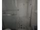 A dated bathroom with shower, toilet, and tile flooring at 4956 Allner St # 4956, New Port Richey, FL 34652