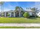 House exterior showcasing a two-car garage and well-maintained lawn at 5012 76Th E St, Bradenton, FL 34203