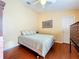 Bedroom with double bed, wood floors, and ceiling fan at 5122 Creekside Trl, Sarasota, FL 34243