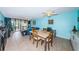 Bright dining area with table and chairs, near living room and kitchen at 7037 Sunset S Dr # 203, South Pasadena, FL 33707