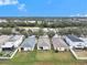 Aerial view of a home near a lake, highlighting its location and fenced backyard in a suburban neighborhood at 7833 Carriage Pointe Dr, Gibsonton, FL 33534