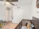 A well decorated Bedroom includes a crib and plenty of space for storage and play at 7833 Carriage Pointe Dr, Gibsonton, FL 33534