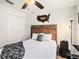 This bedroom offers a wood-styled headboard and closet storage space at 7833 Carriage Pointe Dr, Gibsonton, FL 33534