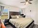 Spacious main bedroom with king-size bed and en-suite bathroom at 7833 Carriage Pointe Dr, Gibsonton, FL 33534