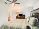 Comfortable main bedroom features a ceiling fan and ensuite bathroom access at 7833 Carriage Pointe Dr, Gibsonton, FL 33534
