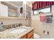 Bathroom with granite vanity, oval sink, and mirrored medicine cabinet at 4042 Boulder Dr, New Port Richey, FL 34653