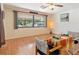 Combined living and dining area with hardwood floors and large windows at 4042 Boulder Dr, New Port Richey, FL 34653