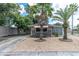Cute bungalow with palm trees, a paved driveway and a well-maintained front yard at 4042 Boulder Dr, New Port Richey, FL 34653