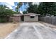House exterior with driveway and side yard landscaping at 4042 Boulder Dr, New Port Richey, FL 34653