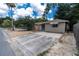 Front view of the house showing the driveway and landscaping at 4042 Boulder Dr, New Port Richey, FL 34653