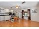 Kitchen with hardwood floors, white cabinets, and stainless steel appliances at 4042 Boulder Dr, New Port Richey, FL 34653