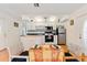 Eat-in kitchen with white cabinets and a butcher block island at 4042 Boulder Dr, New Port Richey, FL 34653
