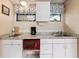 Small kitchen featuring granite countertops and built-in appliances at 4042 Boulder Dr, New Port Richey, FL 34653