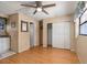 Bedroom with laminate floors, ceiling fan, and a large closet at 4042 Boulder Dr, New Port Richey, FL 34653