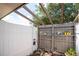Private patio with wooden pergola and potted plants at 4042 Boulder Dr, New Port Richey, FL 34653