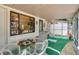 Relaxing screened porch with seating and a table, perfect for outdoor enjoyment at 4042 Boulder Dr, New Port Richey, FL 34653