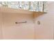 Pink tiled shower stall with grab bar and single shower head at 4042 Boulder Dr, New Port Richey, FL 34653