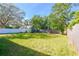 Large backyard with green grass and a shed at 4234 Harrisburg Ne St, St Petersburg, FL 33703