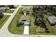 Aerial view of a single-Gathering home with a spacious yard and neighborhood context at 141 Hobo Rd, Rotonda West, FL 33947