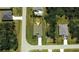 Aerial view showcasing a single-story house situated in a residential neighborhood at 141 Hobo Rd, Rotonda West, FL 33947