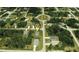 Aerial view showing a house's location within a residential neighborhood at 141 Hobo Rd, Rotonda West, FL 33947