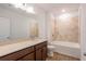 Clean bathroom, featuring a tub and a vanity with a quartz countertop at 141 Hobo Rd, Rotonda West, FL 33947