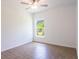 Spacious bedroom with tile flooring and a window at 141 Hobo Rd, Rotonda West, FL 33947