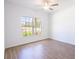 Bedroom with tile flooring and a large window at 141 Hobo Rd, Rotonda West, FL 33947