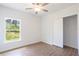 Bright bedroom with tile floors and a large closet at 141 Hobo Rd, Rotonda West, FL 33947