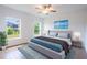 Spacious bedroom with wood-look tile floors and large windows at 141 Hobo Rd, Rotonda West, FL 33947