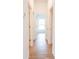 Clean hallway with tile flooring and access to bedrooms at 141 Hobo Rd, Rotonda West, FL 33947