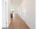 Bright hallway with tile flooring, leading to the kitchen and living areas at 141 Hobo Rd, Rotonda West, FL 33947
