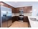 Modern kitchen with stainless steel appliances and dark wood cabinets at 141 Hobo Rd, Rotonda West, FL 33947