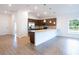 Open-concept kitchen with an island and stainless steel appliances at 141 Hobo Rd, Rotonda West, FL 33947