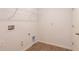 Laundry room with tile floor and built-in shelving at 141 Hobo Rd, Rotonda West, FL 33947