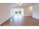 Bright living room features tile flooring and access to a sunroom at 141 Hobo Rd, Rotonda West, FL 33947