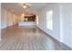 Bright and airy living room with tile floors and views to the kitchen at 141 Hobo Rd, Rotonda West, FL 33947